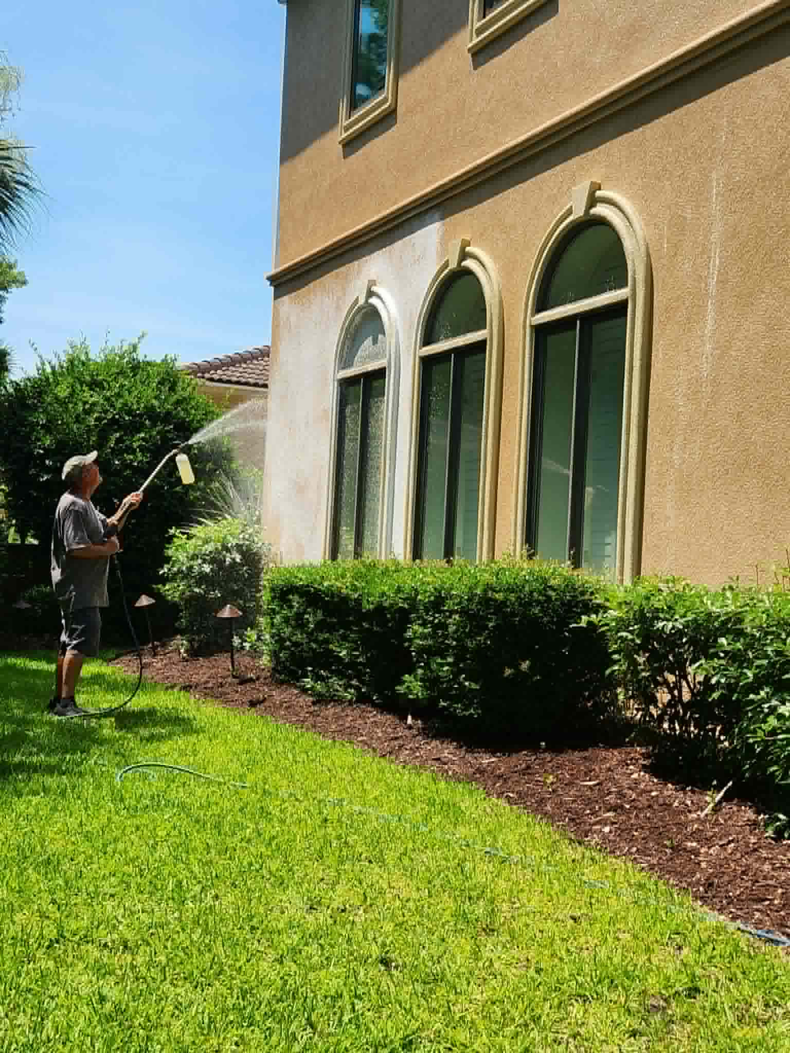 Soft washing the exterior of a house