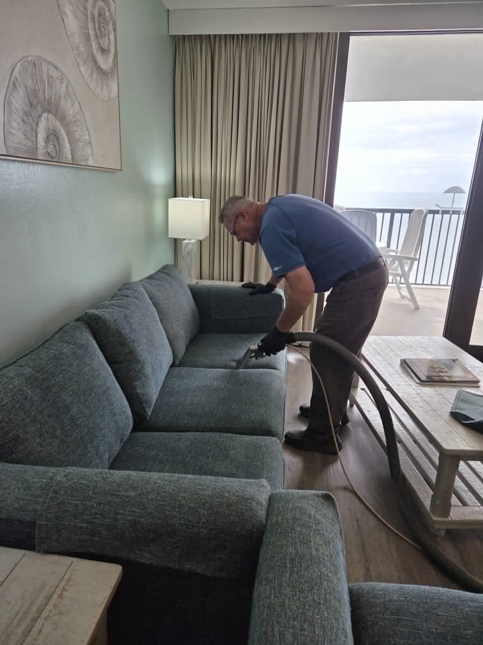 Ultra Brite technician cleaning a couch